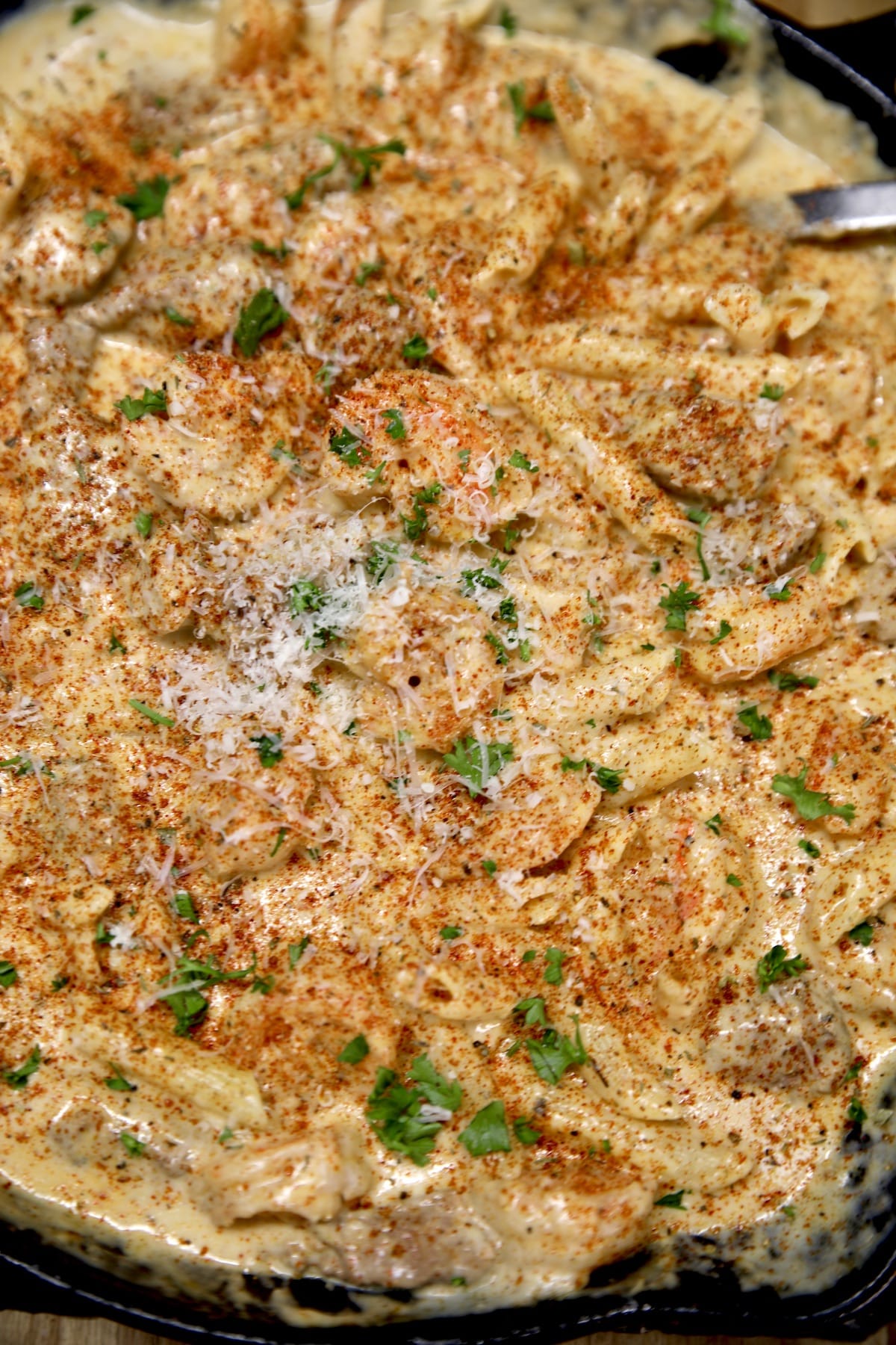 Skillet of steak and shrimp pasta.