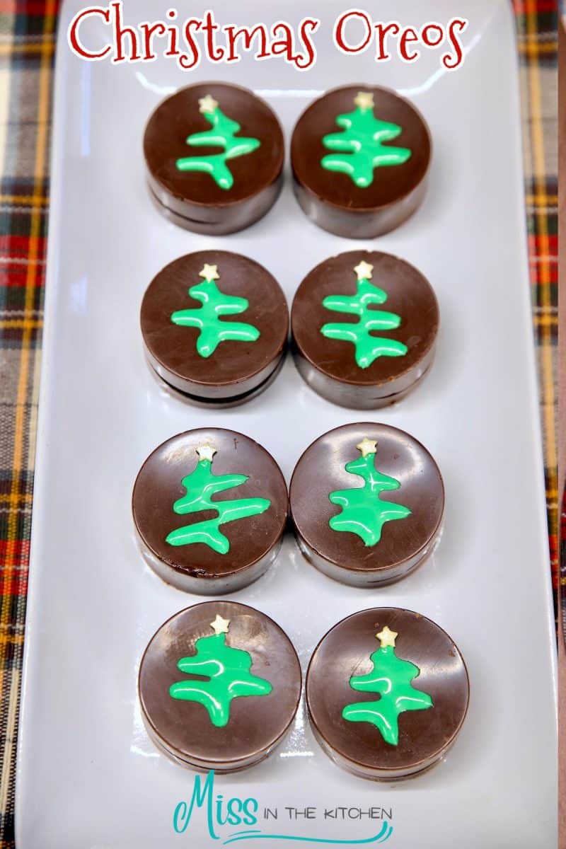 Platter of chocolate covered oreos with Christmas Tree icing.