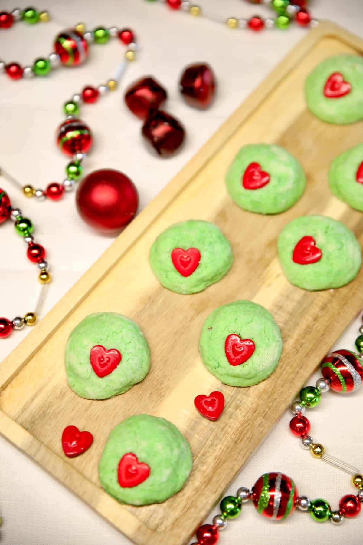 Platter of Grinch Cookies with candy hearts.
