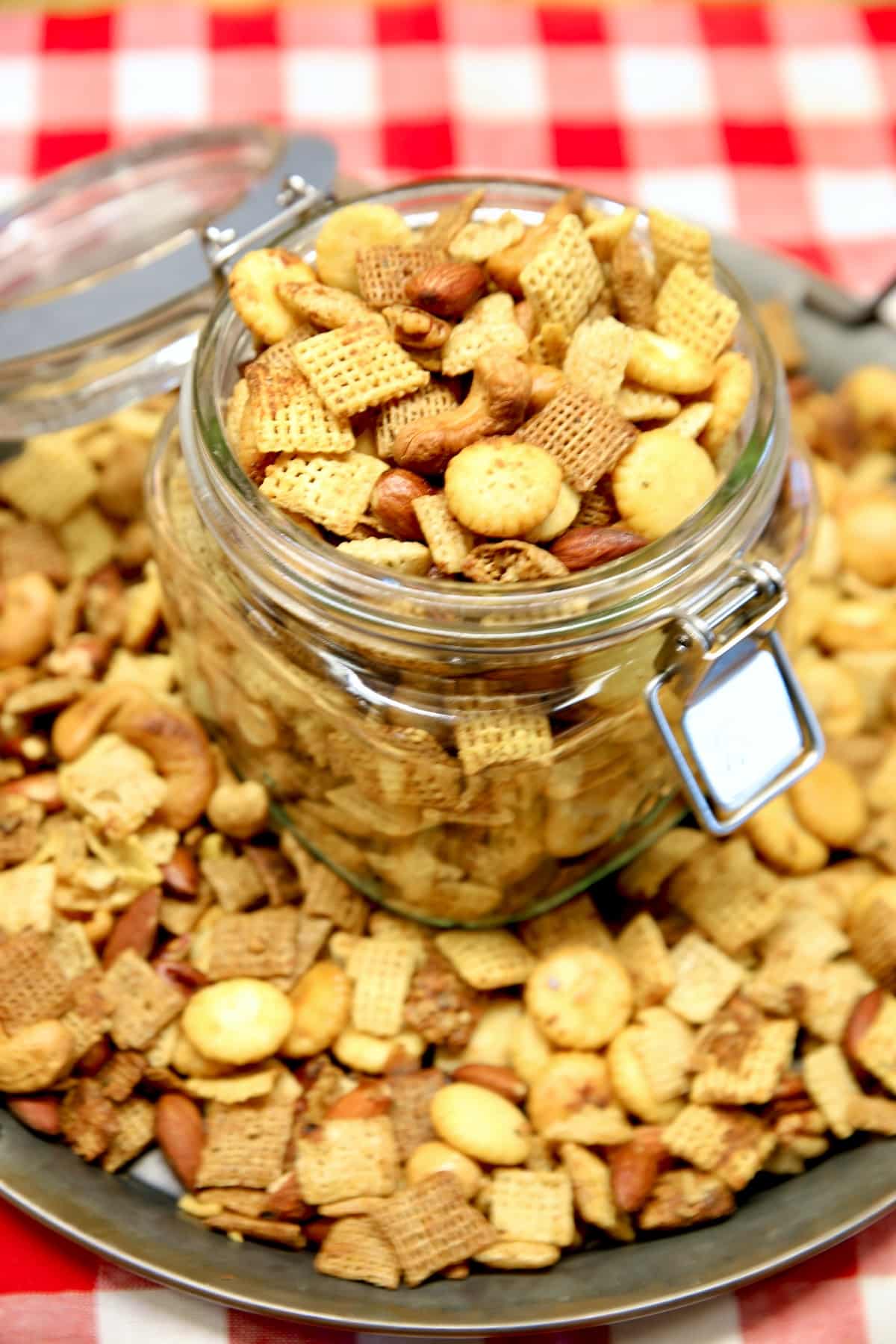 Chex mix on a platter and in a jar.