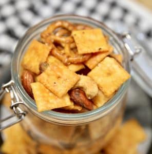 Cheez-It snack mix in a jar with pretzels and nuts.