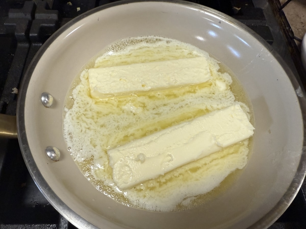 Melting 2 sticks of butter in a pan.