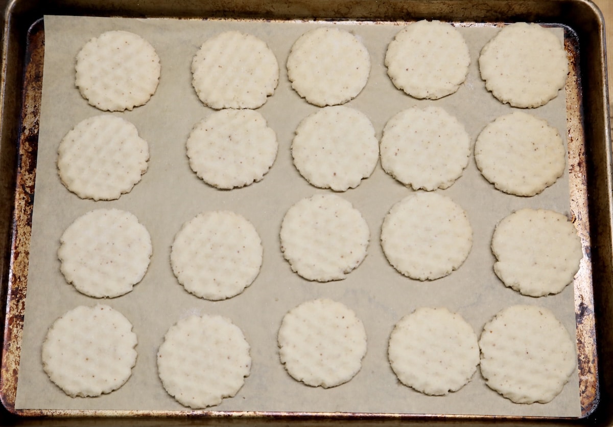 Baked sugar cookies on a baking sheet.