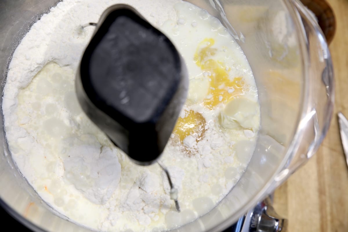 Bowl of cake mix, eggs, butter, milk.
