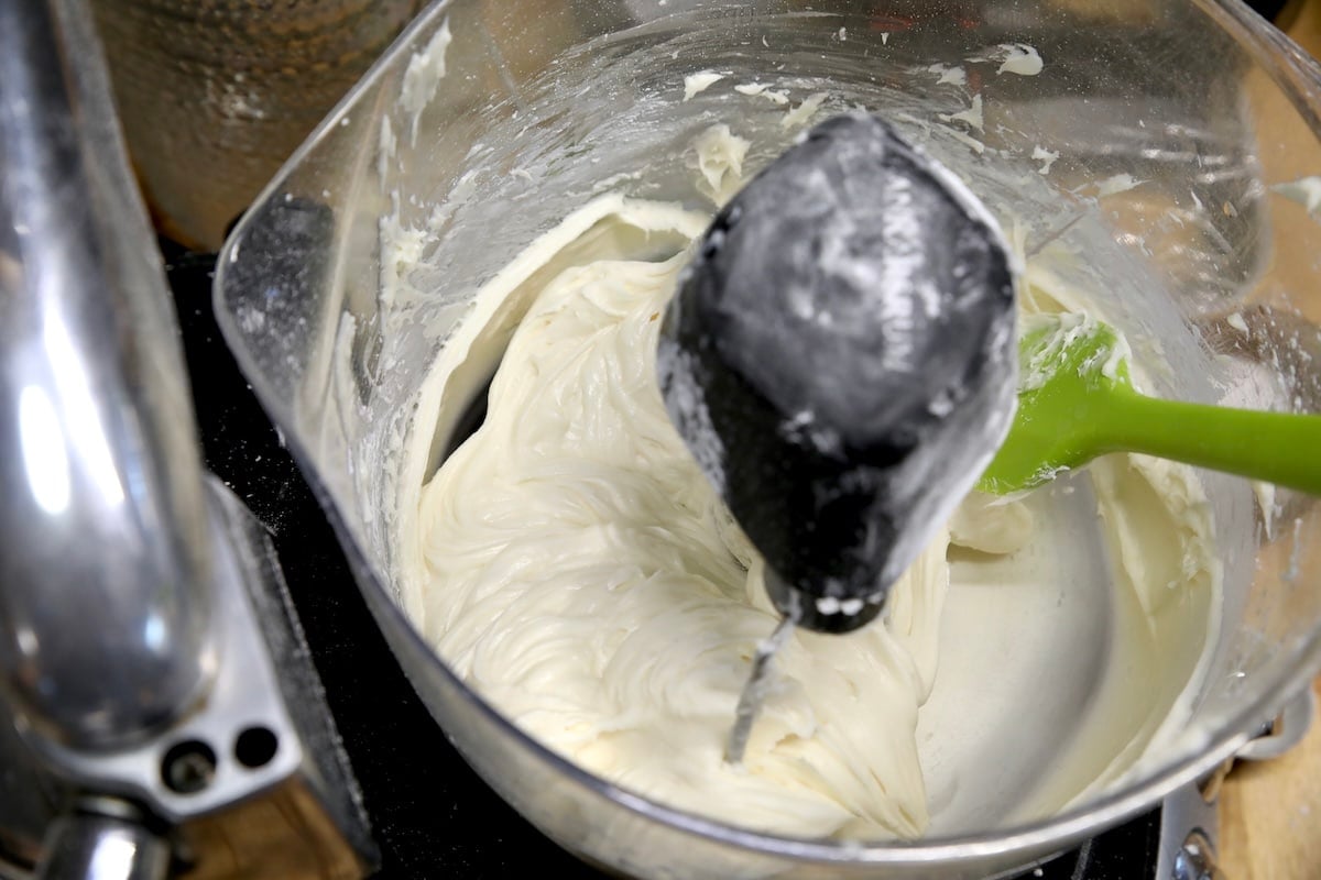 Cream cheese frosting in a mixer bowl.