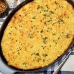 Corn pudding casserole in oval dish.
