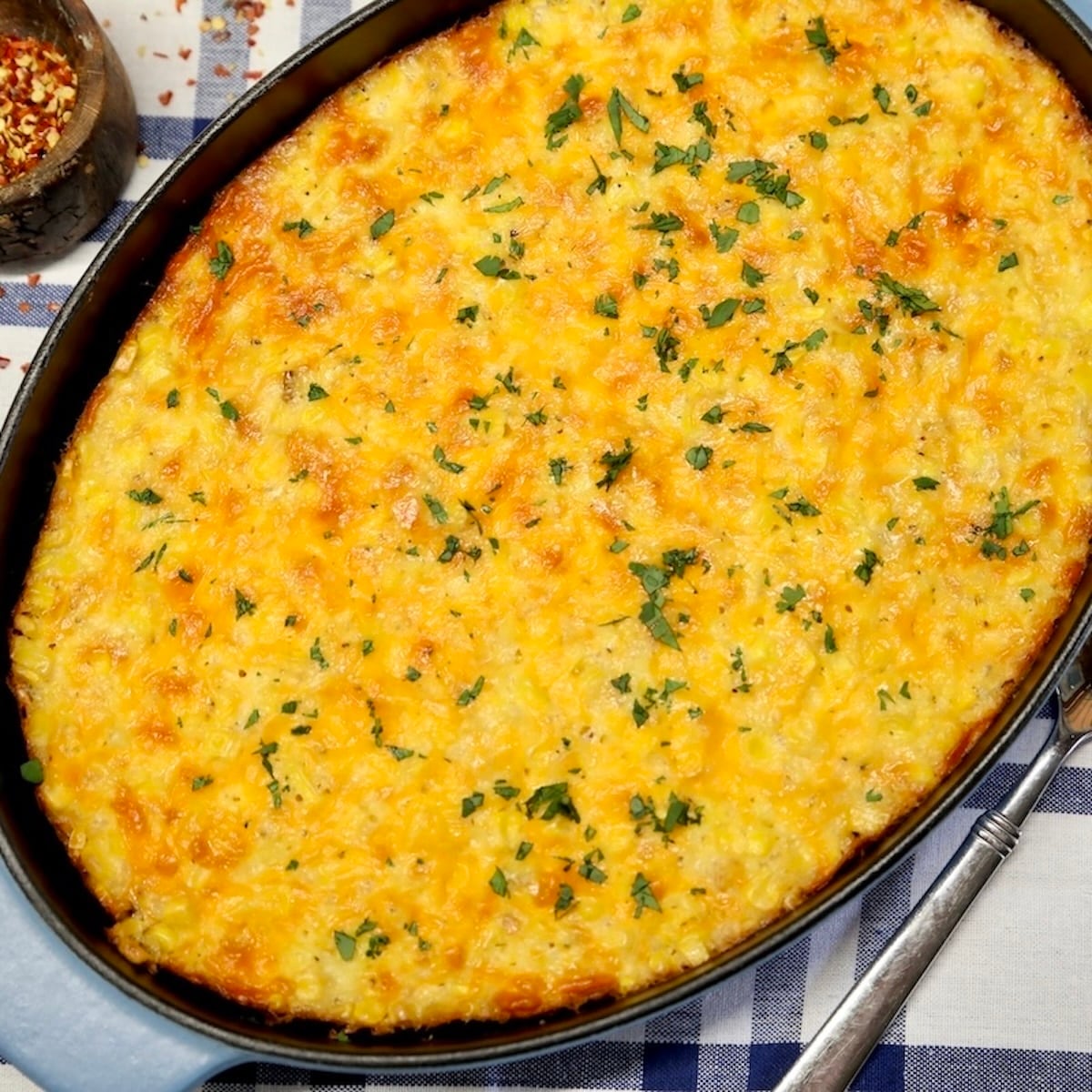 Corn pudding casserole in oval dish.