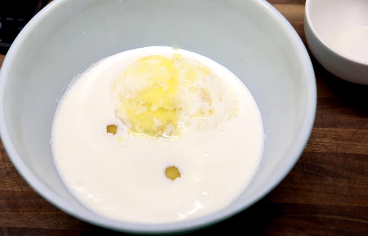 Mixing bowl of cream, butter, eggs.