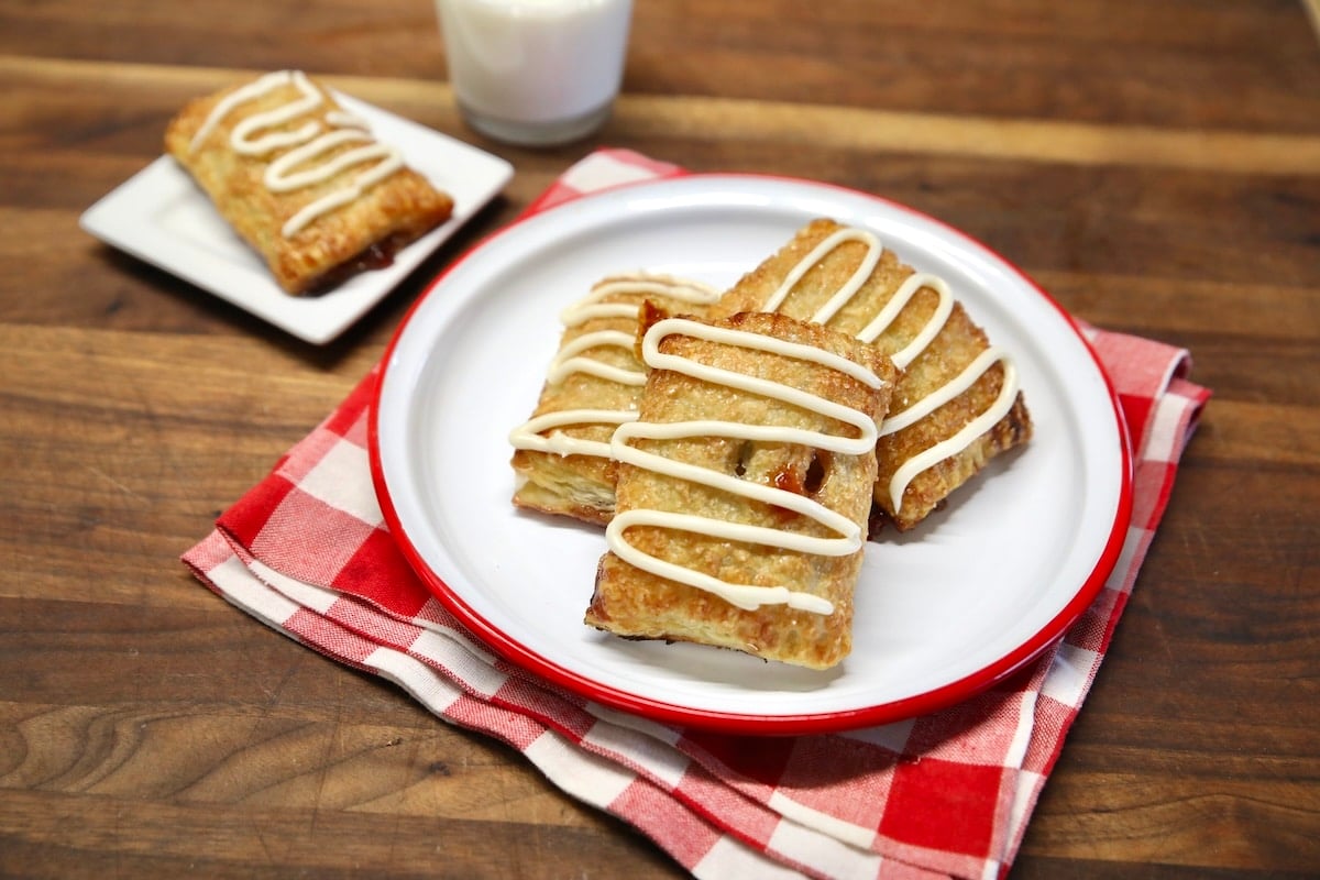 3 puff pastry toaster strudels on a plate.
