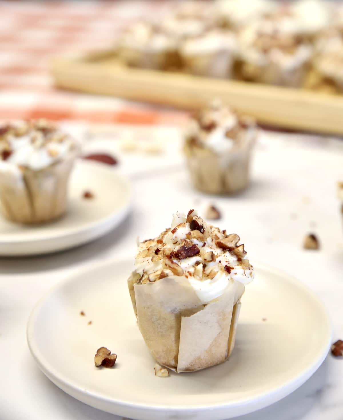 Mini butter pecan cupcake on a small plate.