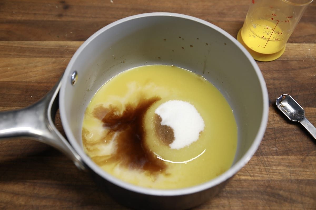Saucepan with orange glaze ingredients.