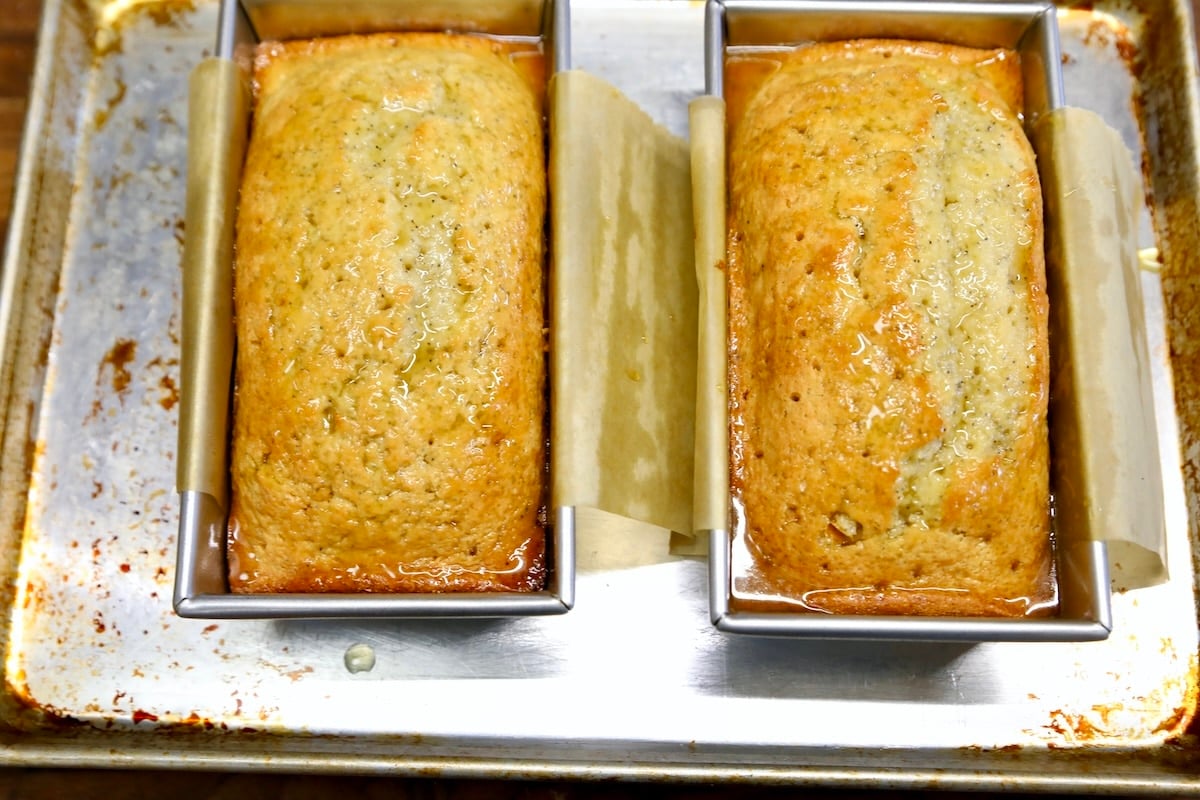 2 loaves of orange glazed poppy seed bread.