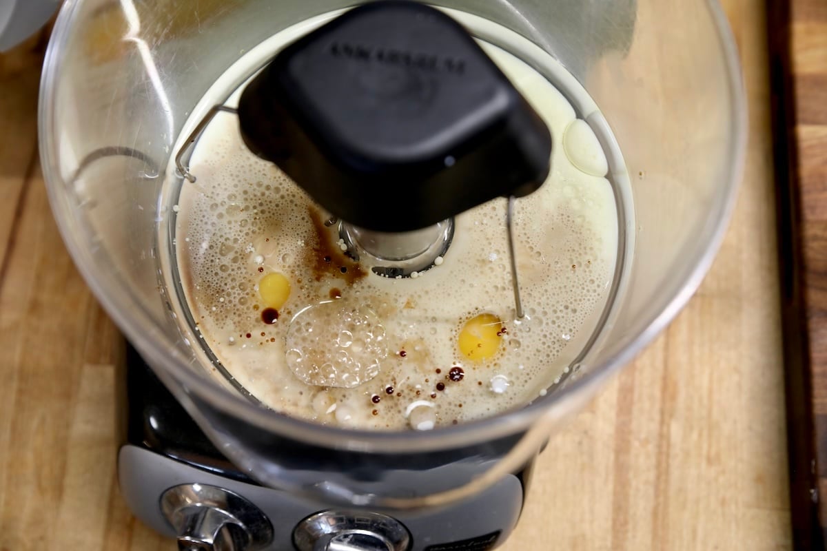 Mixer with eggs, milk, vanilla for quick bread.
