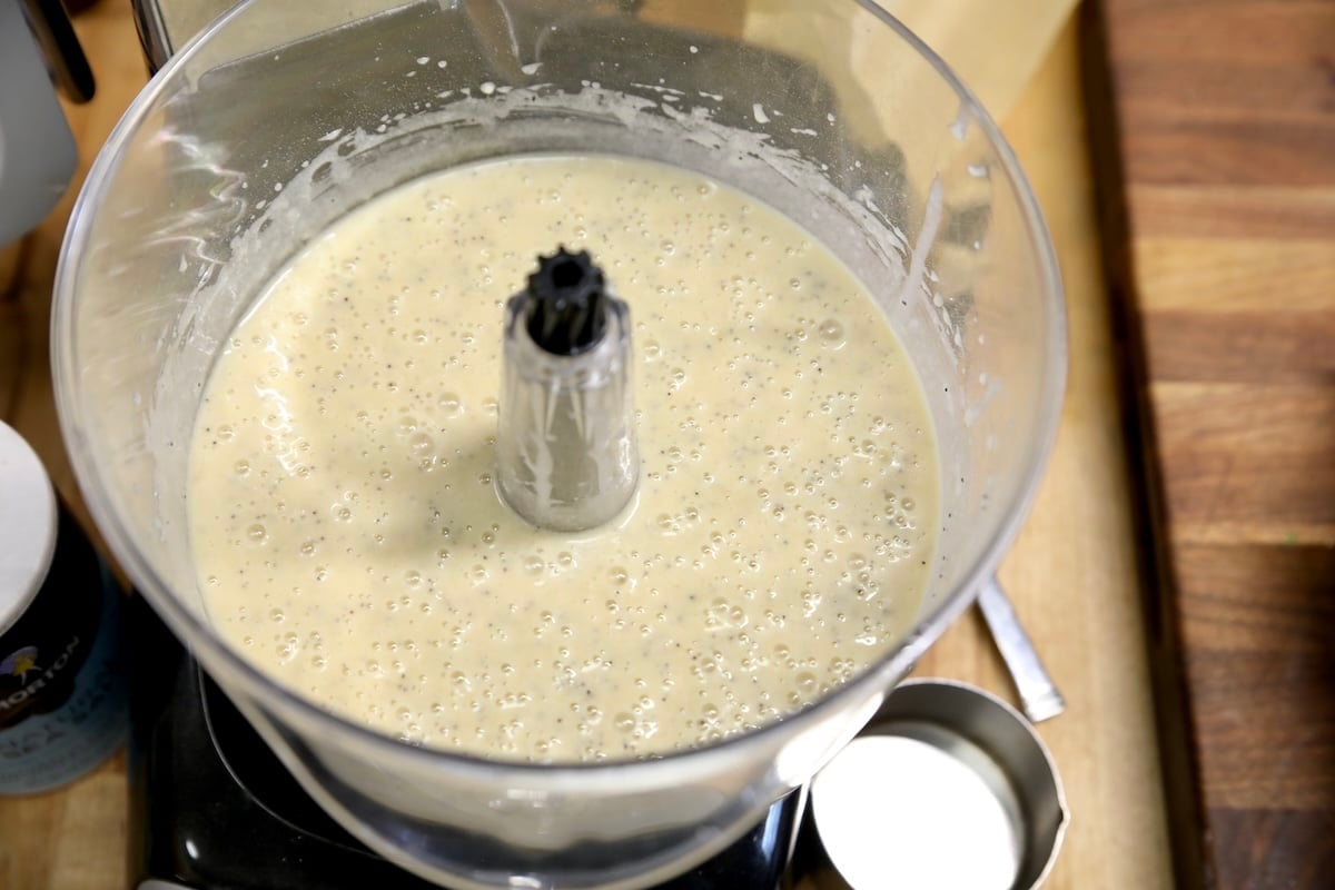 Mixer bowl with poppy seed bread batter.