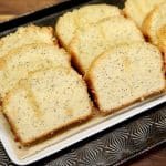 Tray of poppy seed bread slices.