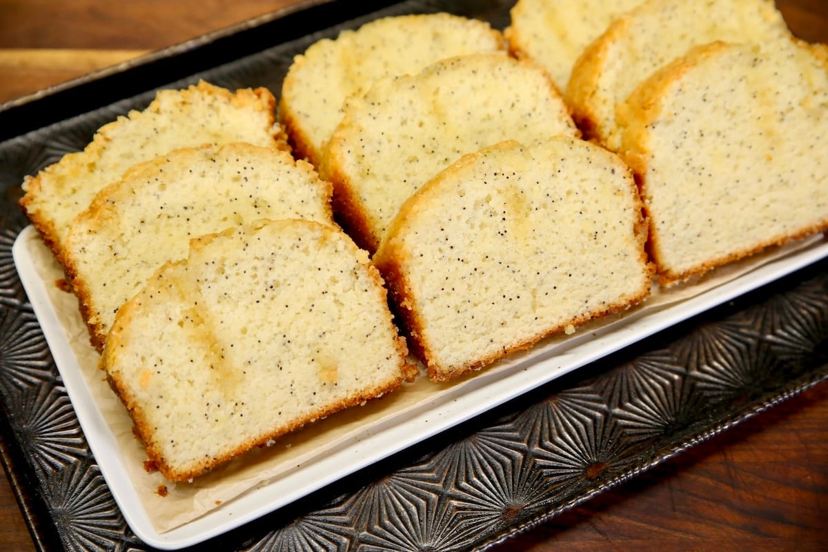Platter of sliced poppy seed bread.