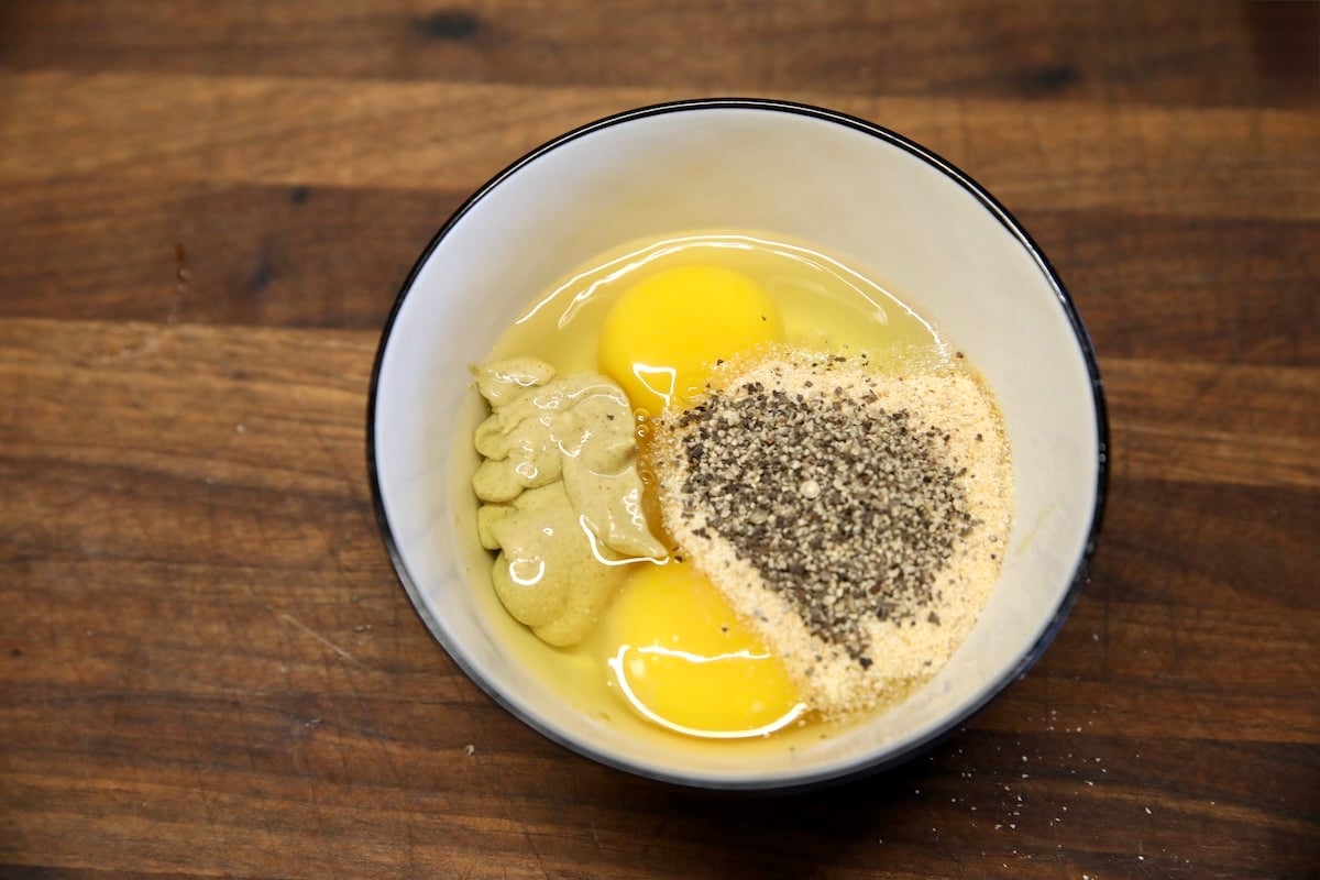 Eggs, mustard and spices in a bowl.