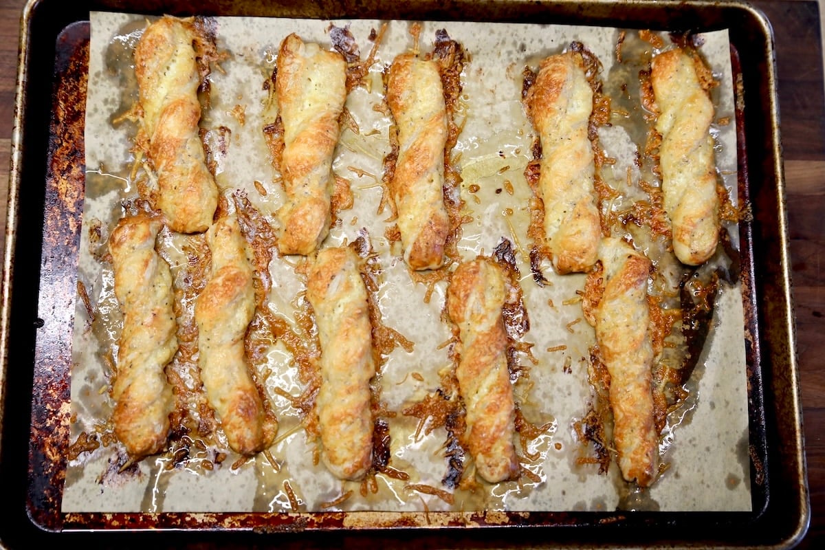Cheese twists made with puff pastry. Baked puff pastry twists.
