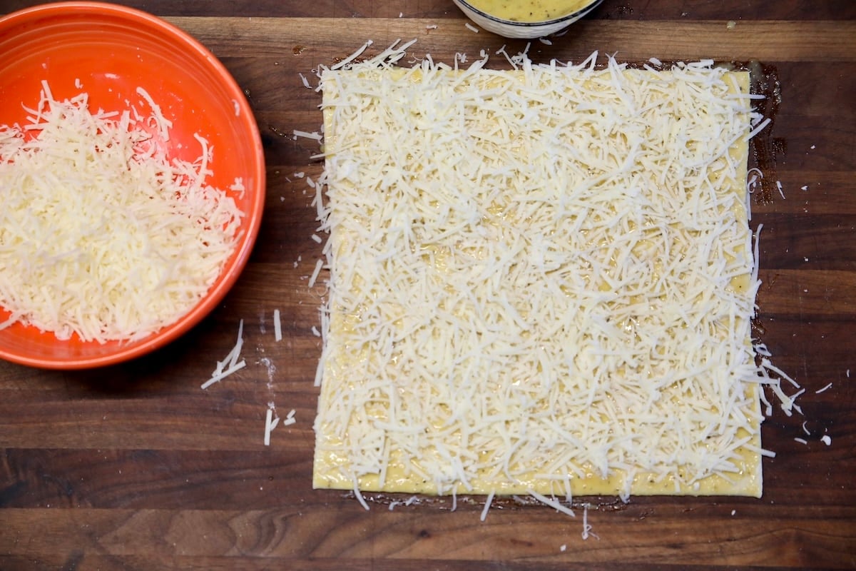 Puff pastry sprinkled with cheese.