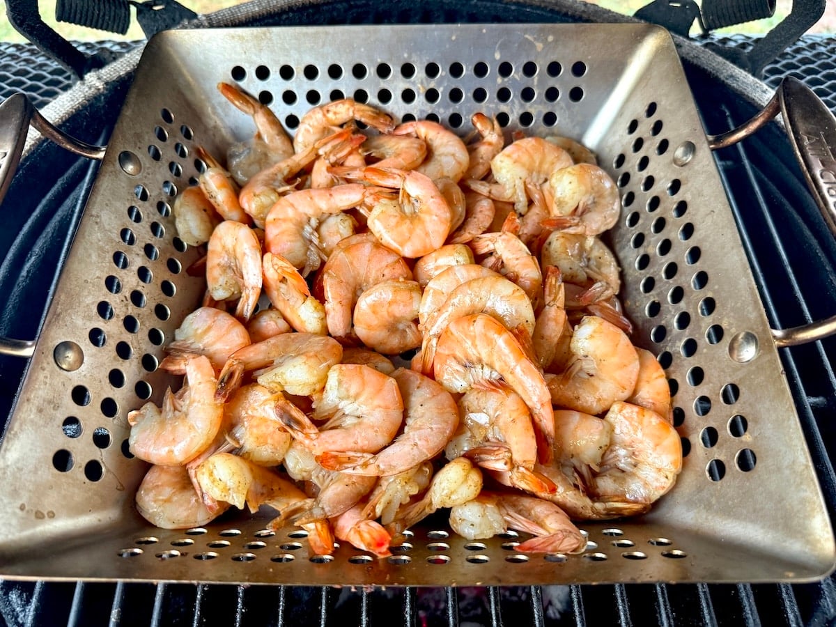 Grill basket with shrimp.