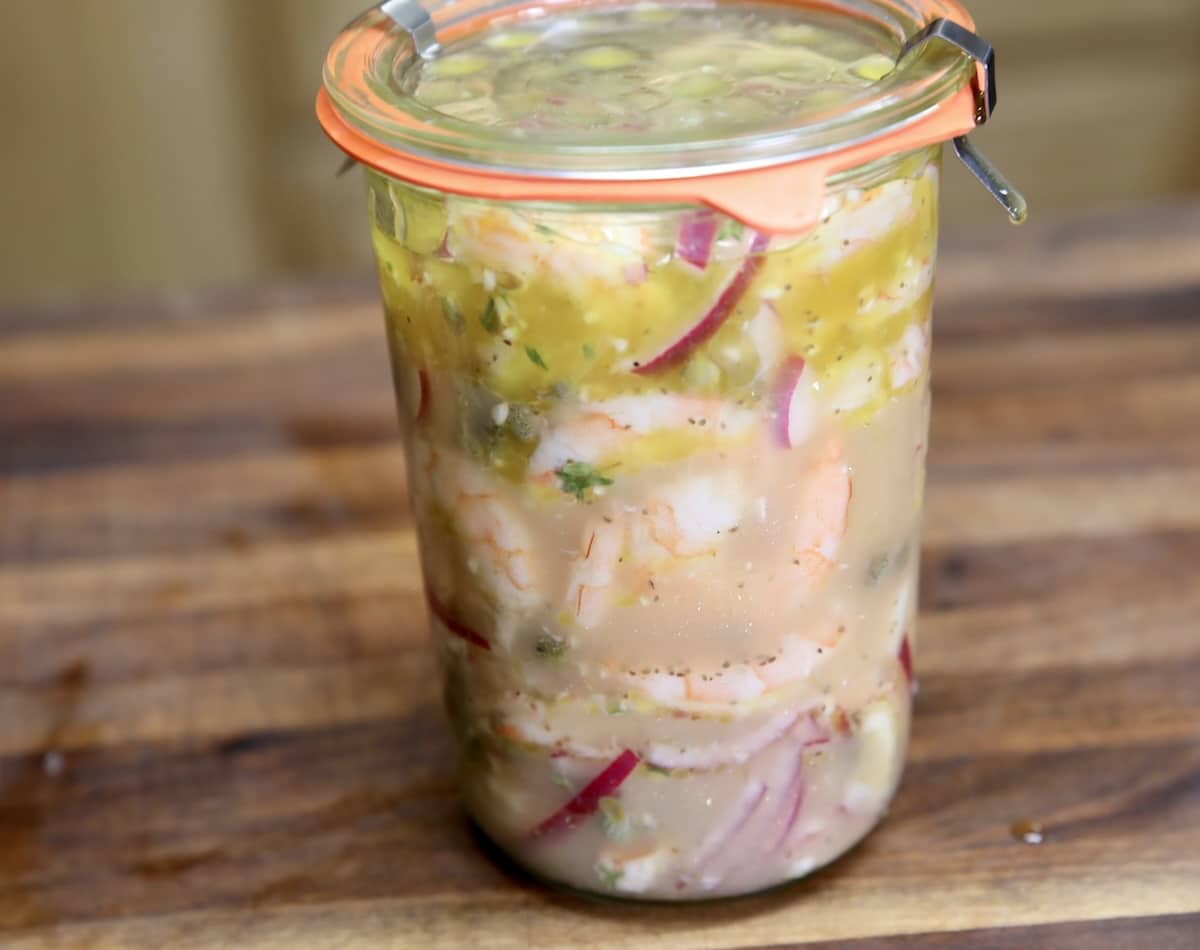 Sealed jar of pickled shrimp.