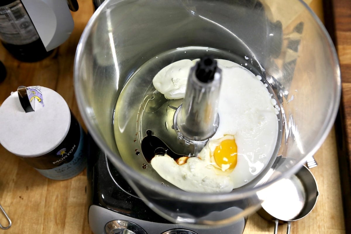 Mixer bowl with egg, buttermilk, vanilla.