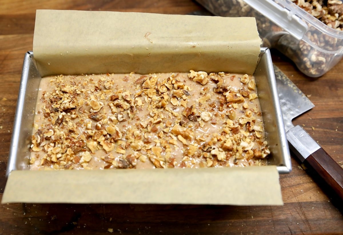 Walnut bread in loaf pan ready to bake.