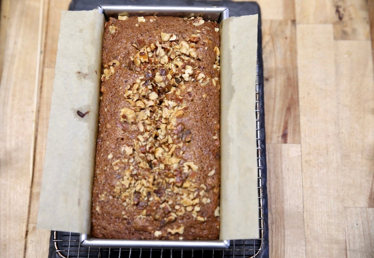 Baked walnut loaf in a bread pan.