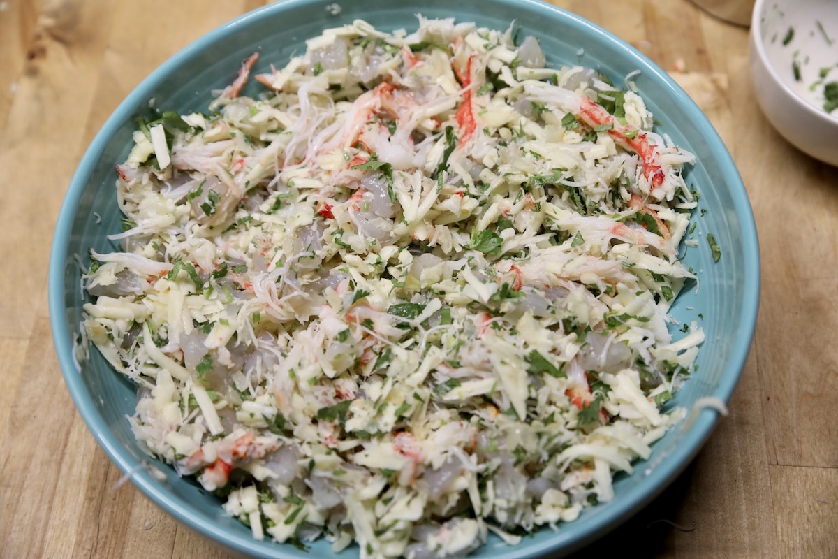 Seafood enchiladas filling in a bowl.