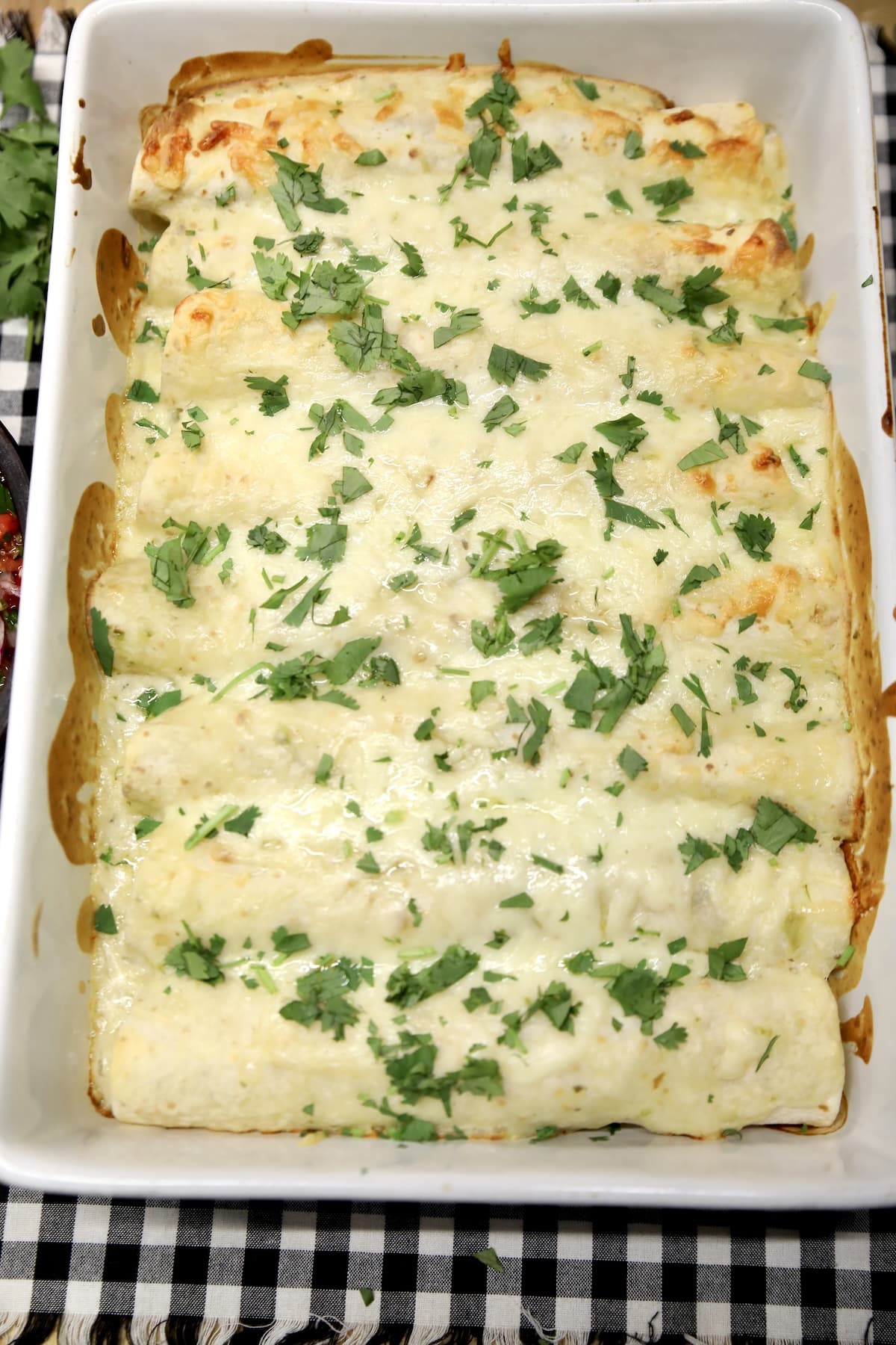 Seafood Enchiladas with creamy salsa verde sauce.