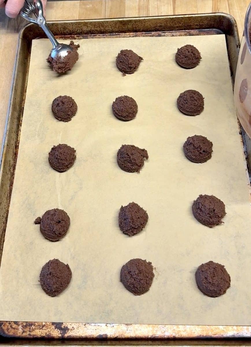 Chocolate cookie dough on a baking sheet.