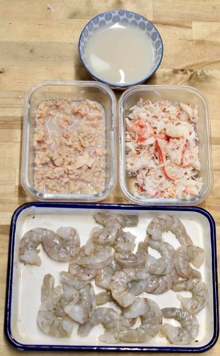 Ingredients for seafood soup - clams, crab, shrimp.