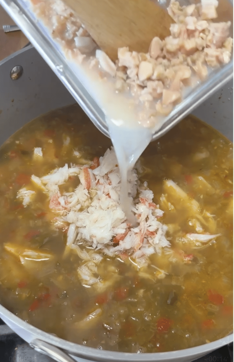 Adding clams to soup. 