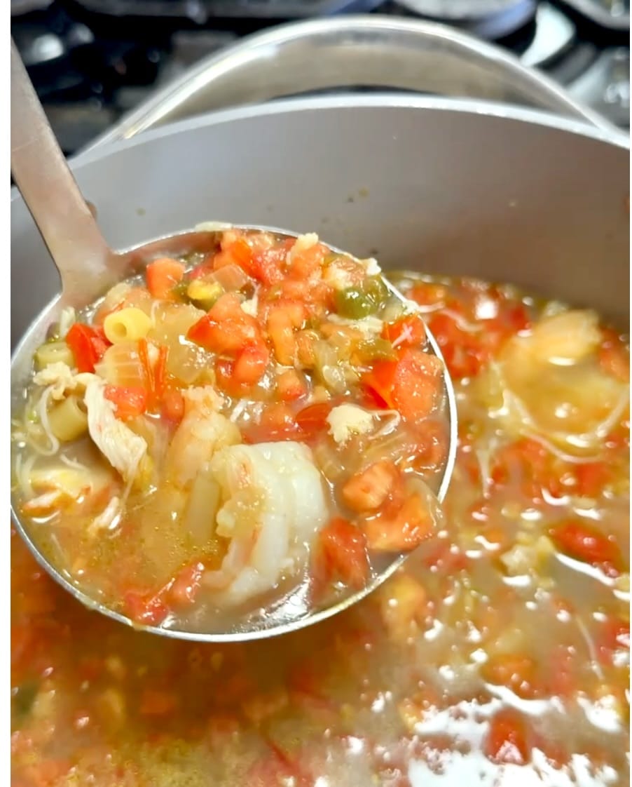 Ladle of seafood soup.