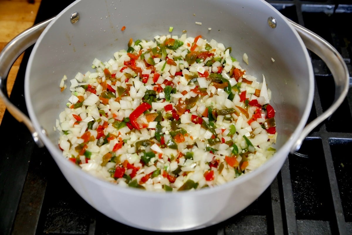 Cooking vegetables in a pan for soup.