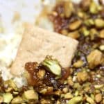 Boursin fig dip with a cracker.