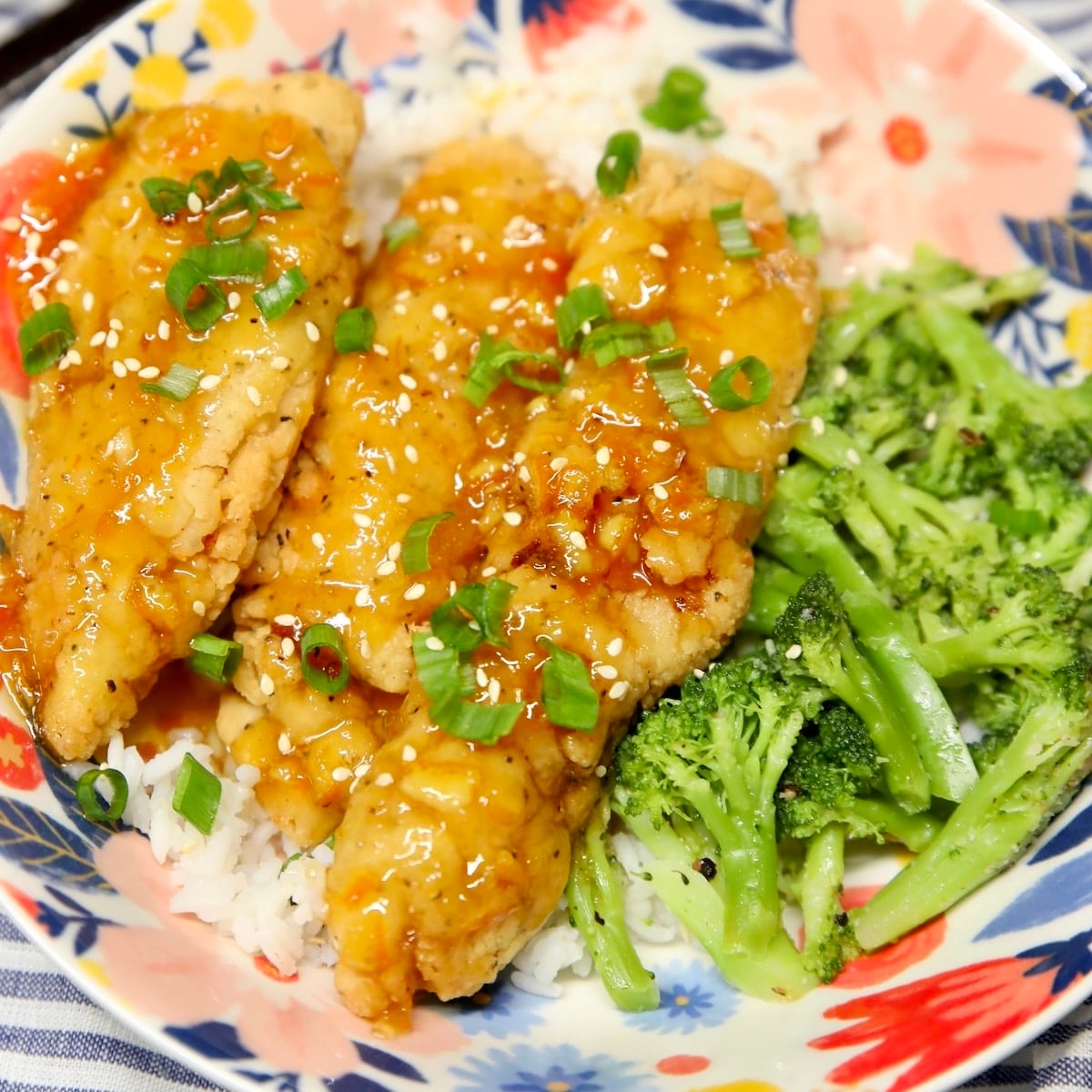 Orange chicken bowl with broccoli.