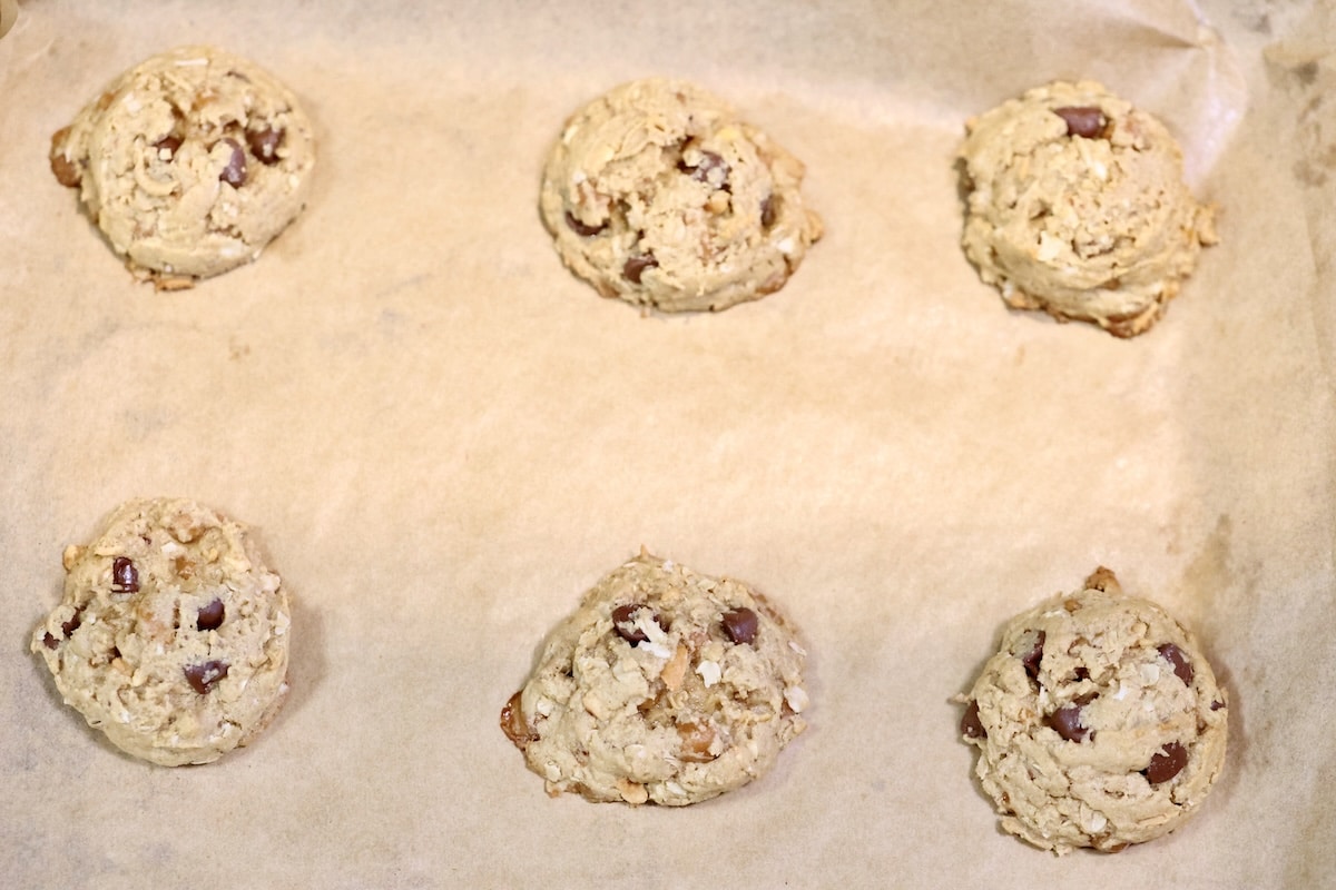 Baked cookies on a parchment lined baking sheet.