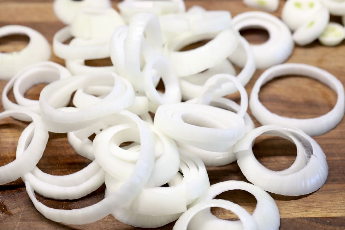 Sliced onions separated into rings.
