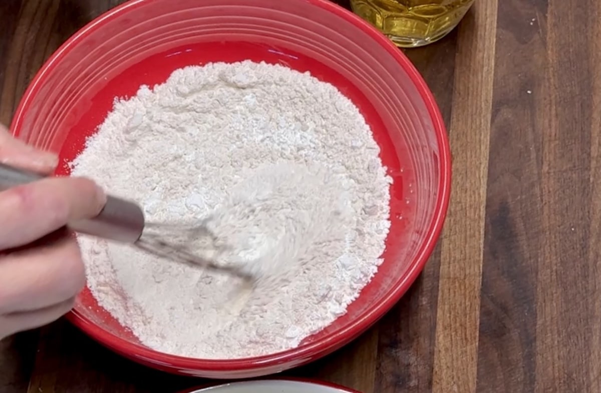 Making beer batter for onion rings.