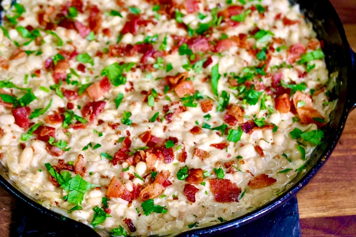White beans with bacon and creamy parmesan sauce.
