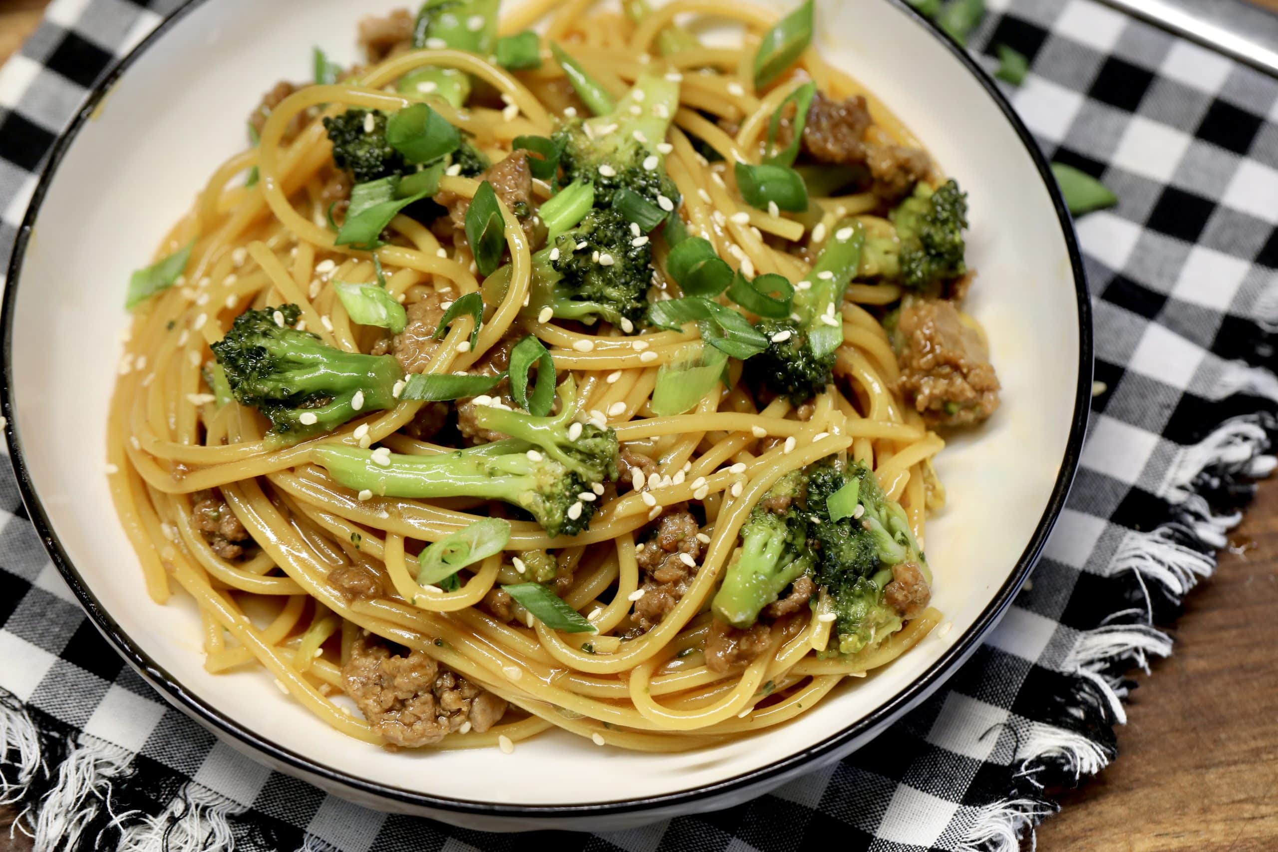 Asian Ground beef and noodle bowls. Ground beef and Asian noodles with broccoli in a bowl.
