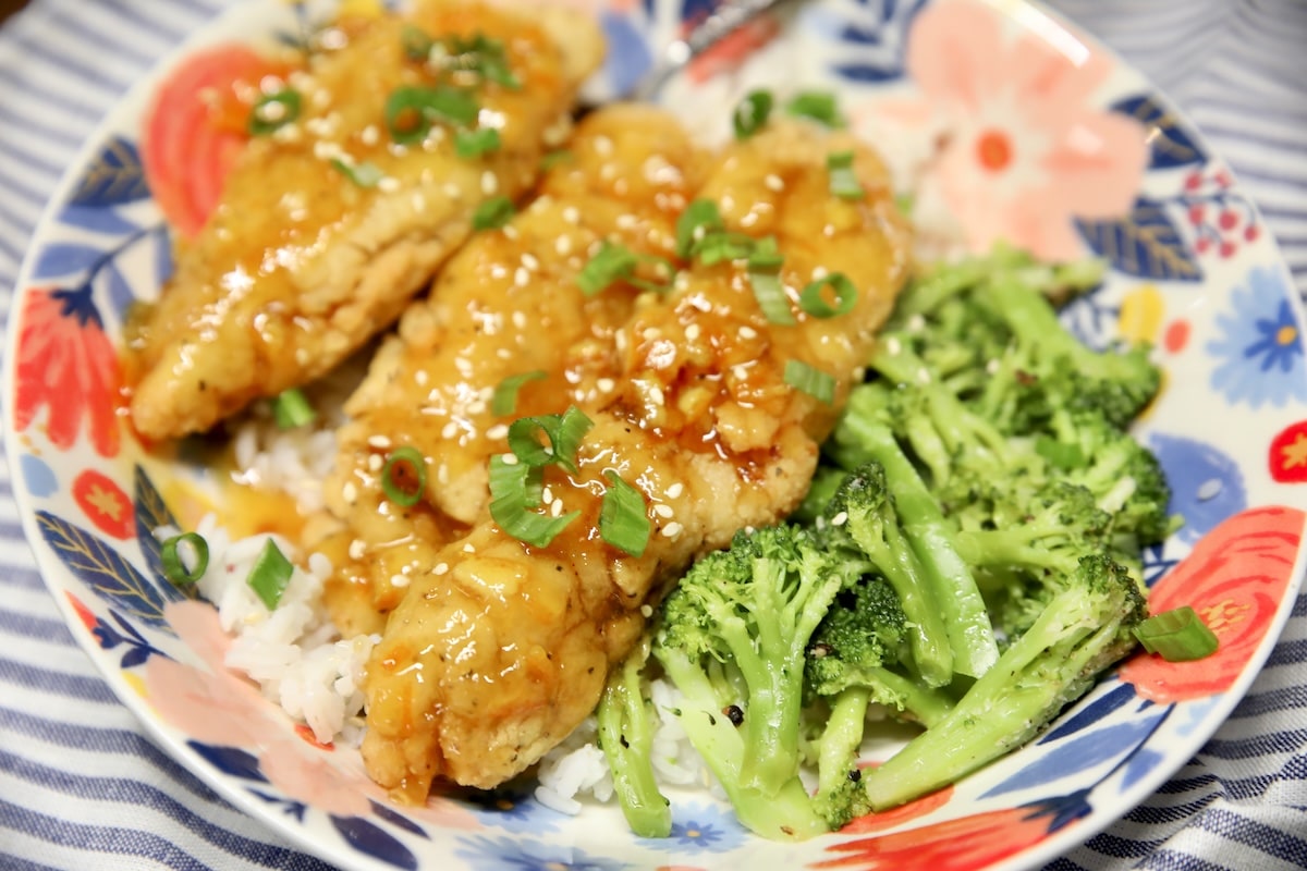 Orange chicken broccoli bowl. Orange chicken bowl with rice and broccoli.