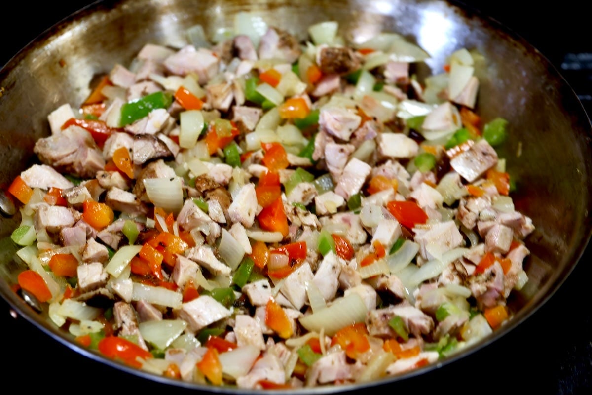 Peppers, onions and chicken for fajita filling.