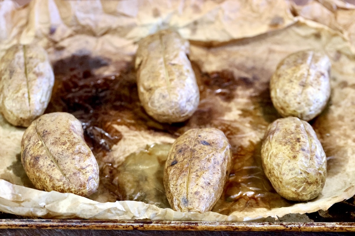 Baked potatoes on a baking sheet.