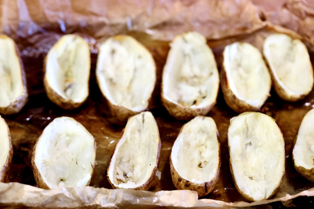 Potato skins on a baking sheet.