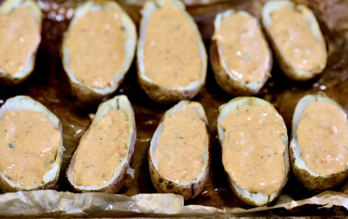 Potato skins filled with chili cheese dip.