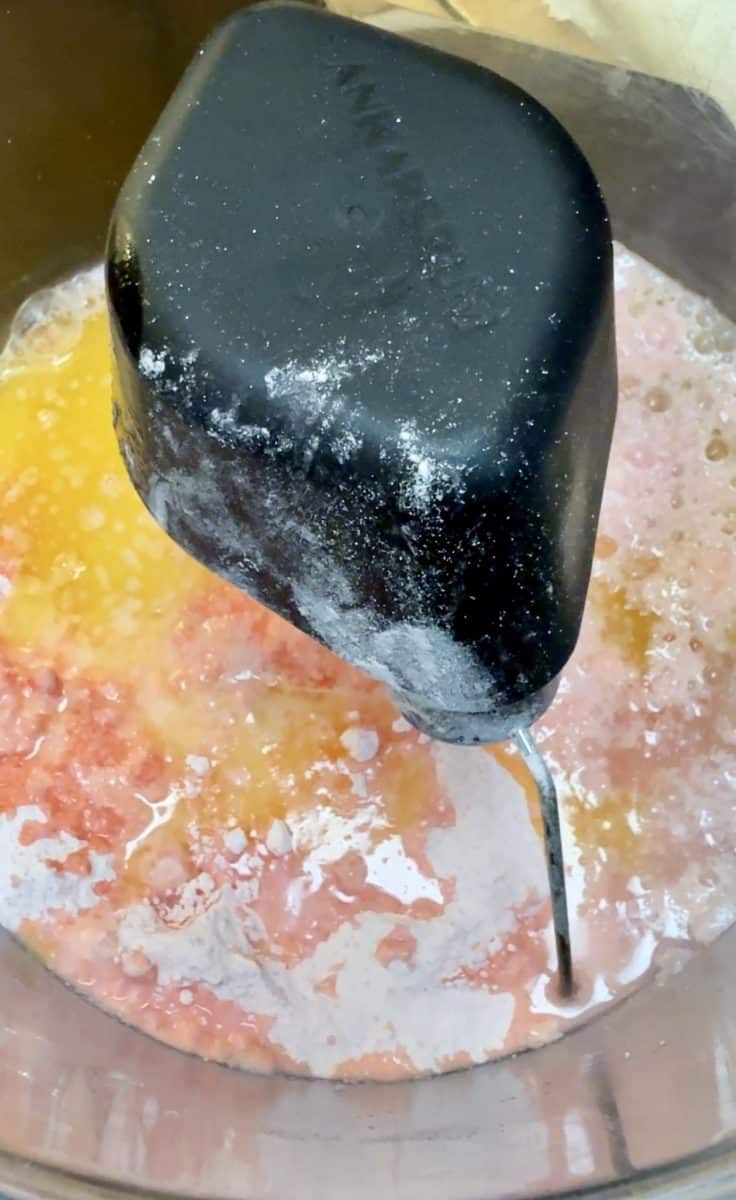 Cake mix, butter, eggs, water in a mixer bowl.