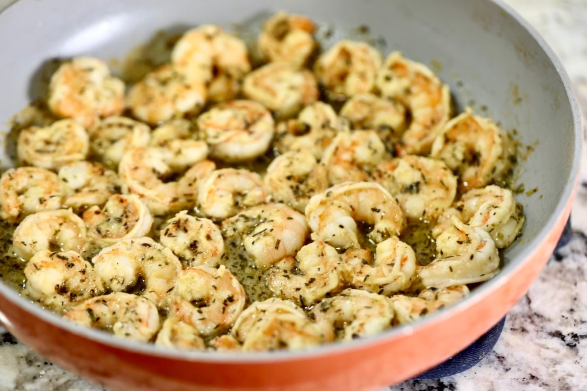 Cooked shrimp in a skillet.