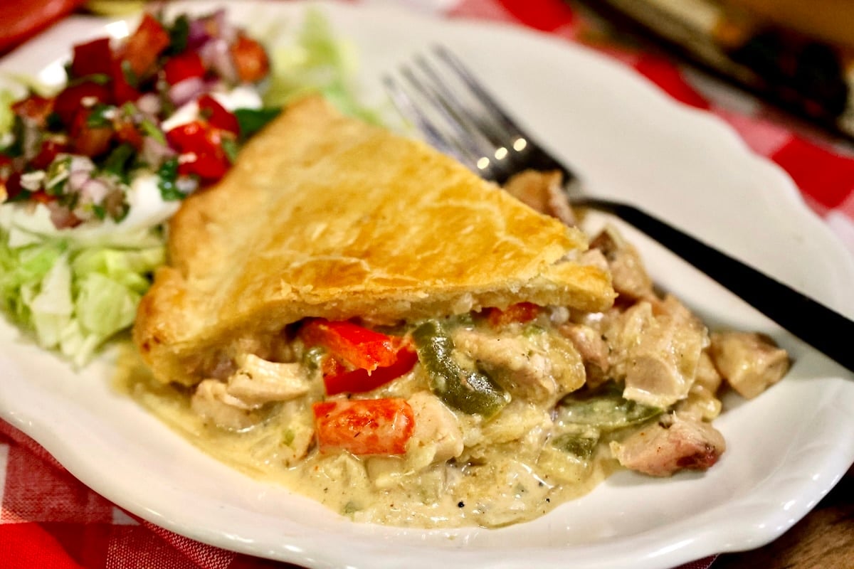 Chicken pot pie with chicken, peppers and onion filling.